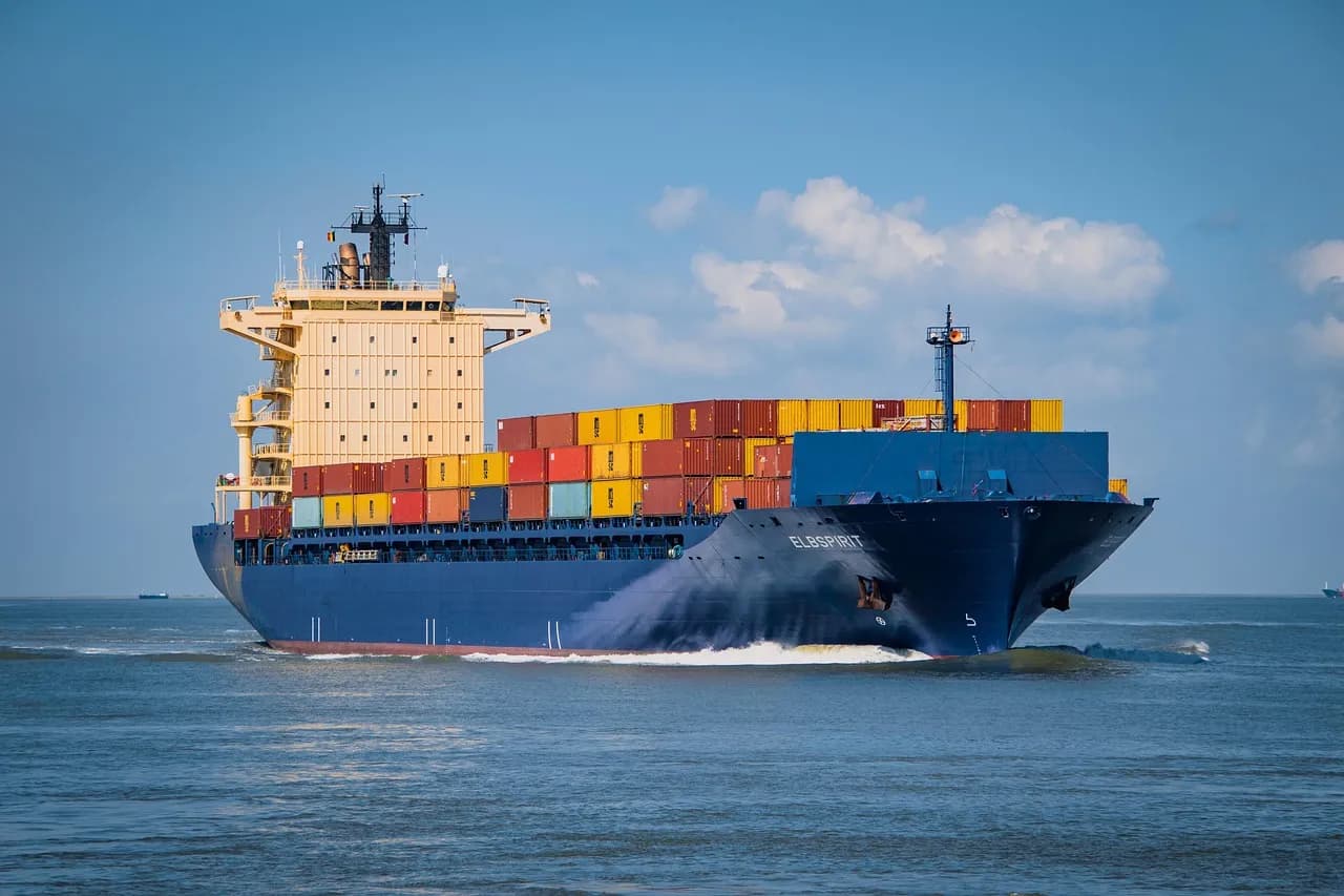 Loaded container ship sailing on the open sea
